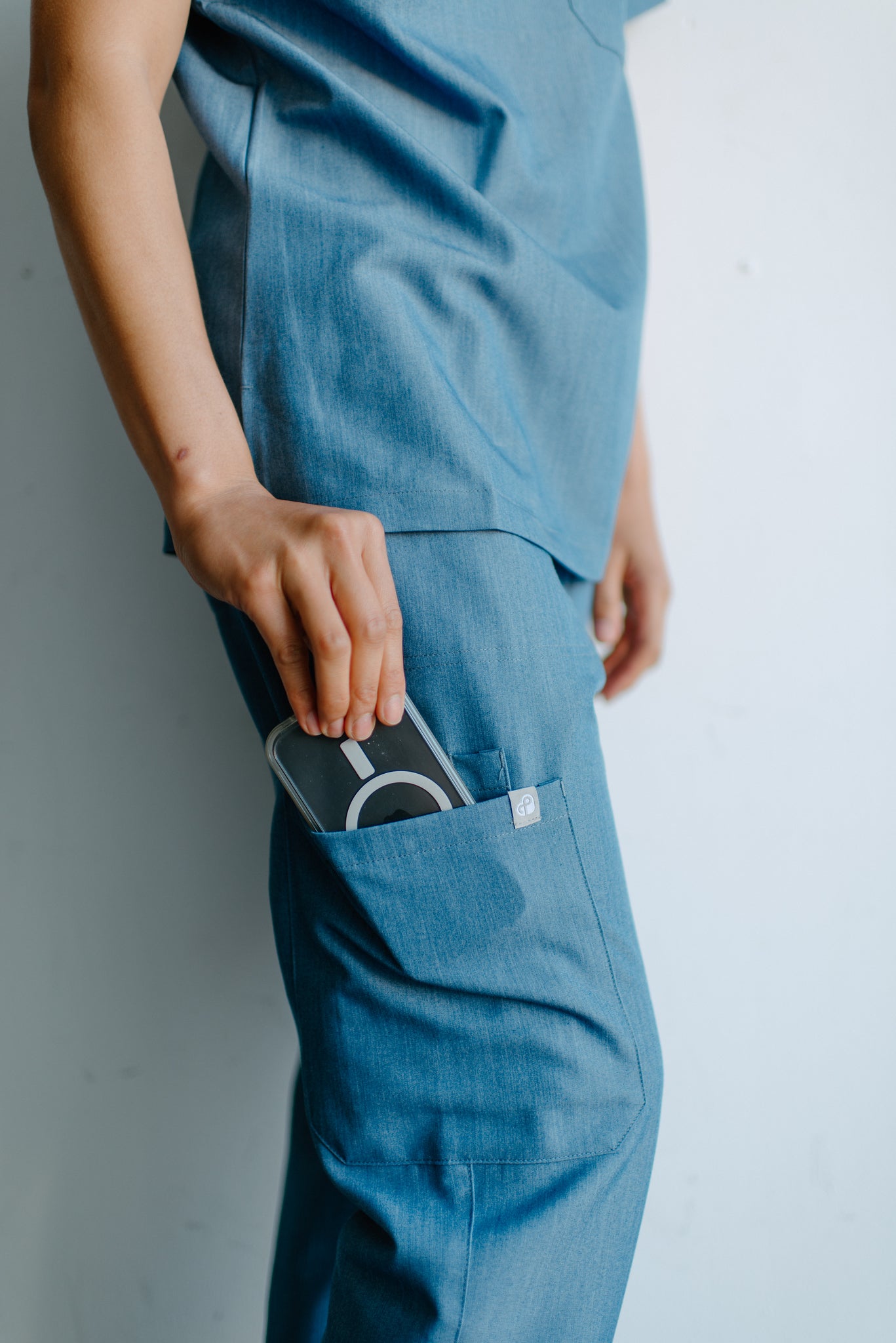 Isla One-Pocket Scrub Top in Shock ‘em Chambray