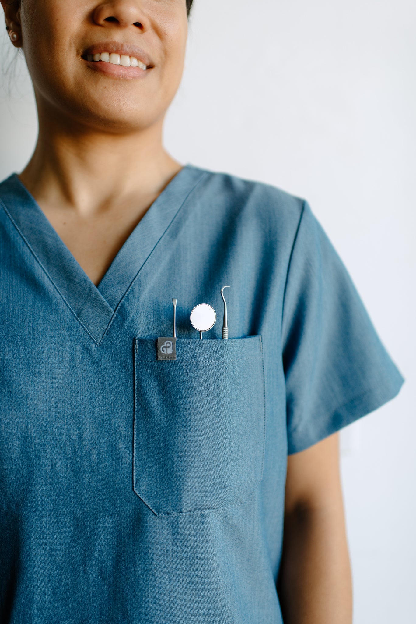 Isla One-Pocket Scrub Top in Shock ‘em Chambray